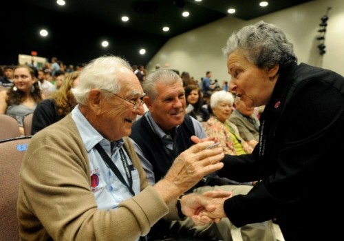 Holocaust survivor Ariela Rojek, right, was 11 years old in 1945 when she and 2,500 other concentration camp prisoners aboard a train near Magdeburg, Germany, were liberated by American forces including 1st Lt. Frank Towers, left with his son Frank Towers Jr., center. "You gave me my second life," Rojek told Towers Wednesday, Sept. 21, 2011, at Hudson Falls High School during an event reuniting soldiers and survivors. Jason McKibben Glens Falls Post Star